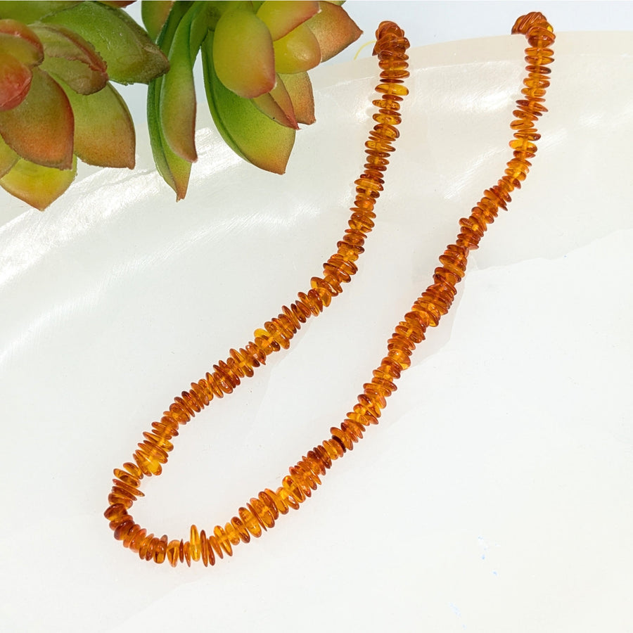 Baltic Amber 1mm chip beads strand featuring irregular-shaped amber stones