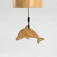 Thumbnail for Wooden dolphin lamp hanging on a wall with Bamboo Concert Chime 14’ for the Seasons #LV1882