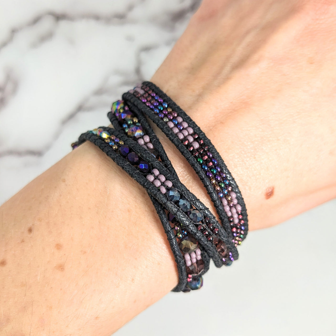 Black wrap bracelet with beads displayed in Beaded Triple Wrap, Woven 7’ Bracelet #LV2656