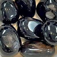Polished black obsidian stones from Black Agate Tumbled Bliss Crystals showcasing banding types