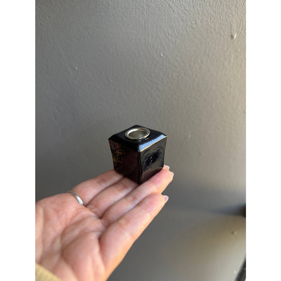 Small dark square black glass ritual candle holder for ambiance and decoration