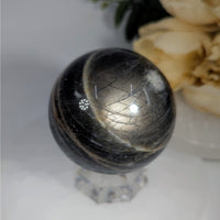 Striated black and silver sphere from Black Moonstone 2 Inch Sphere Mama Jan Collection