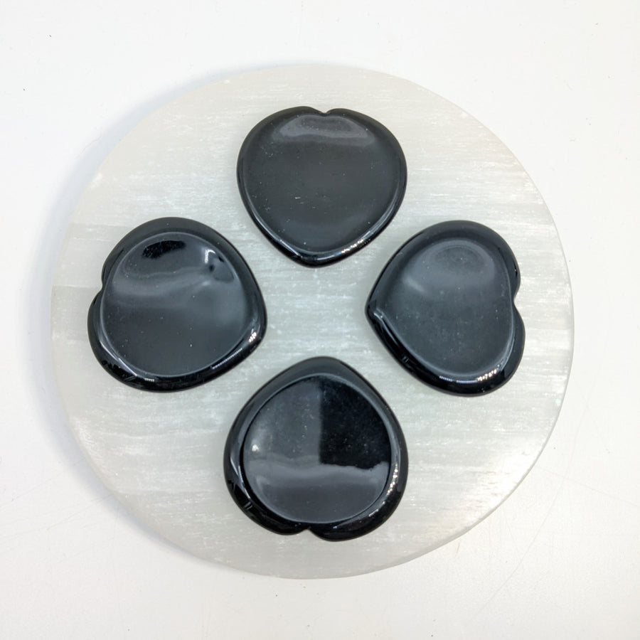 Selenite plate with black heart-shaped stones Black Obsidian 1.5’’ Thumb Heart Stone