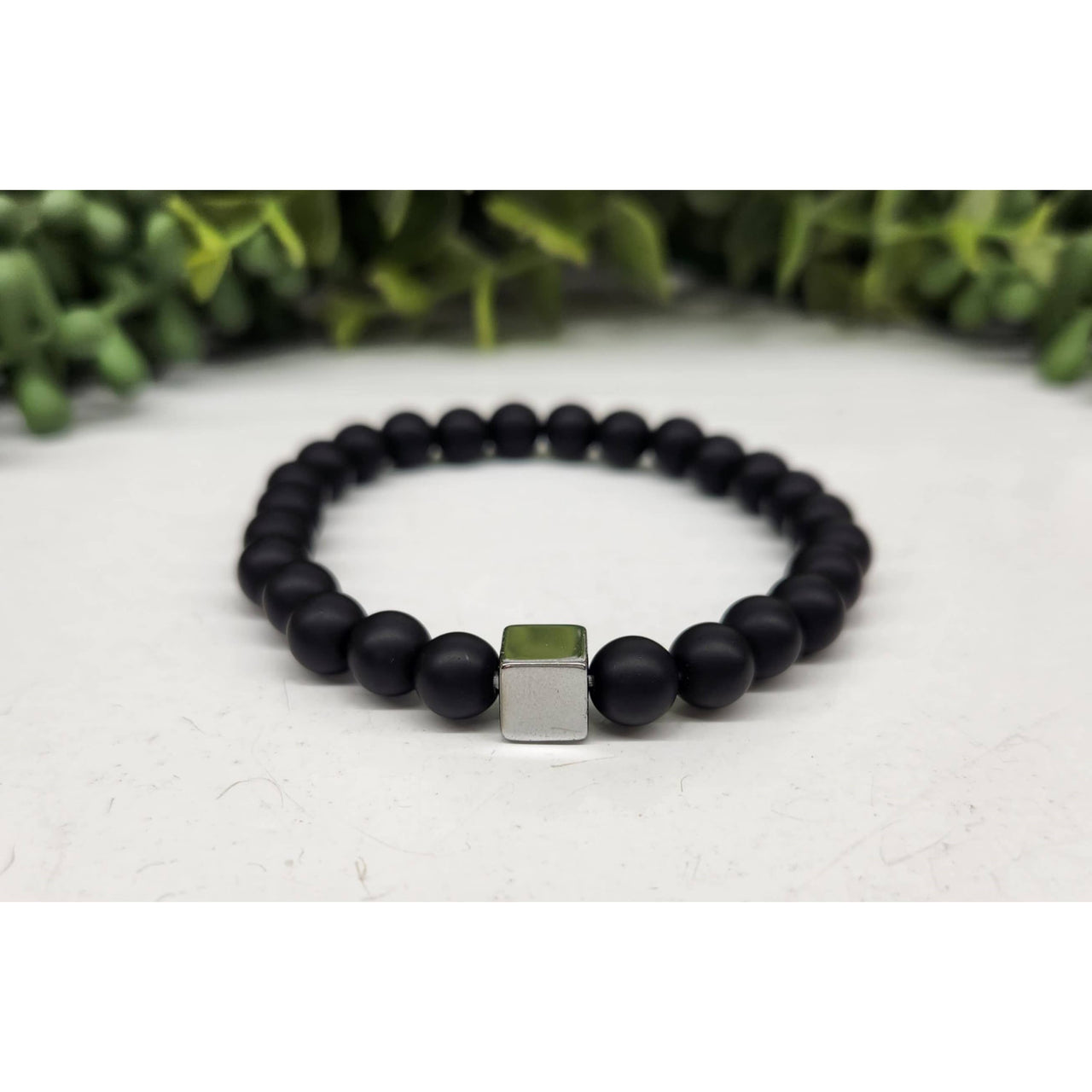 Black matte beaded bracelet with silver green accents and gun metal cube, LV9508