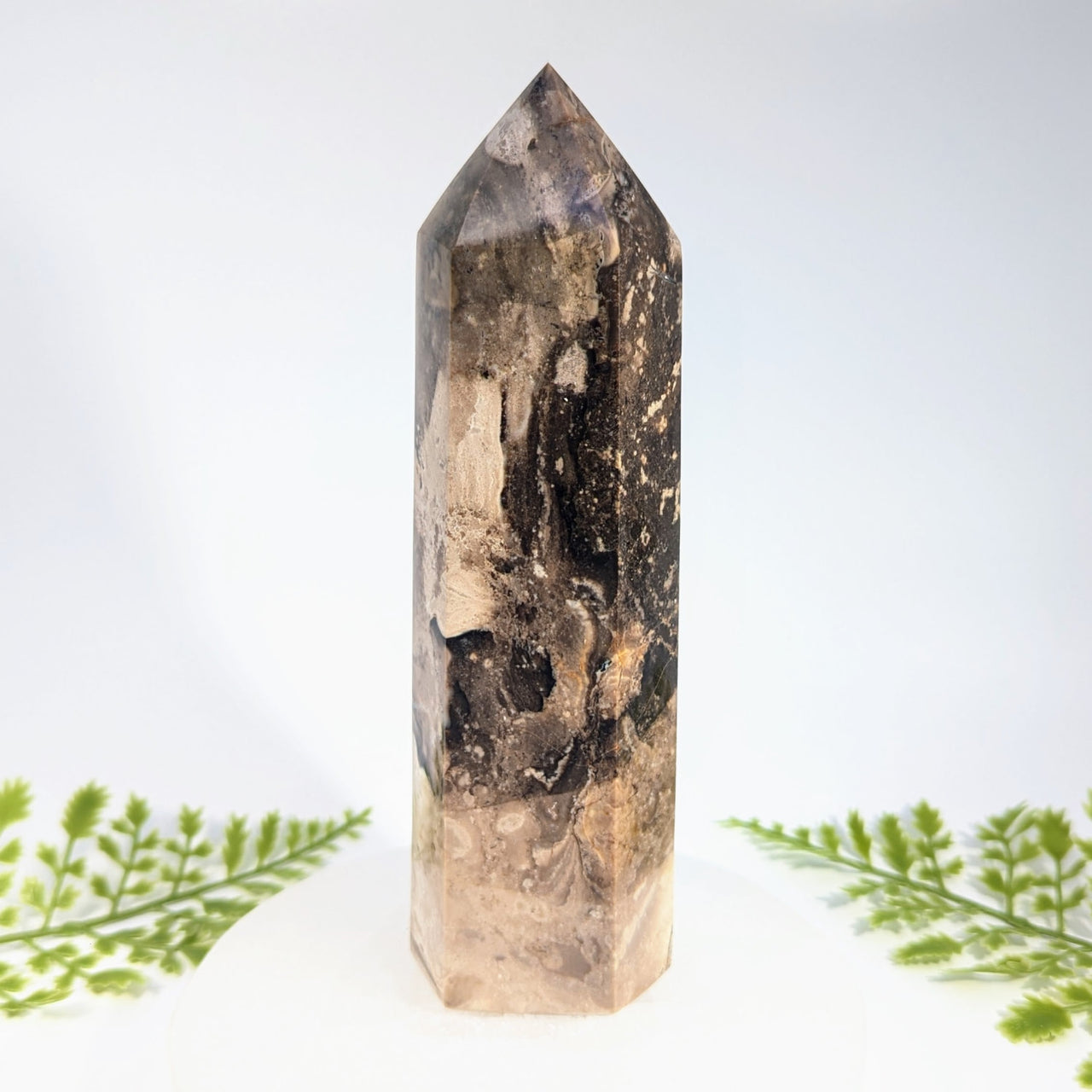 Black opal 7 inch quartz crystal tower with hexagonal facets and swirling brown black and beige patterns for jewelry and crystals
