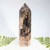Black opal 7 inch quartz crystal tower with hexagonal facets and swirling brown black and beige patterns for jewelry and crystals