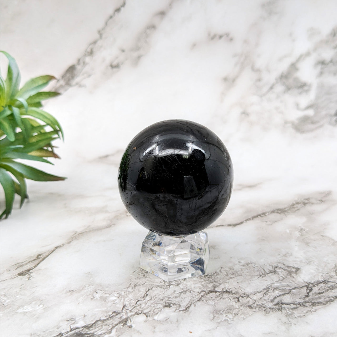 Black tourmaline marble ball on a marble table - Black Tourmaline Sphere #LV5250