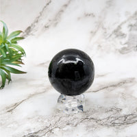Thumbnail for Black tourmaline marble ball on a marble table - Black Tourmaline Sphere #LV5250