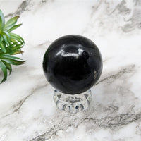 Thumbnail for Black Tourmaline 2.4’ Sphere #LV5247 on a marble table for elegant decor and healing