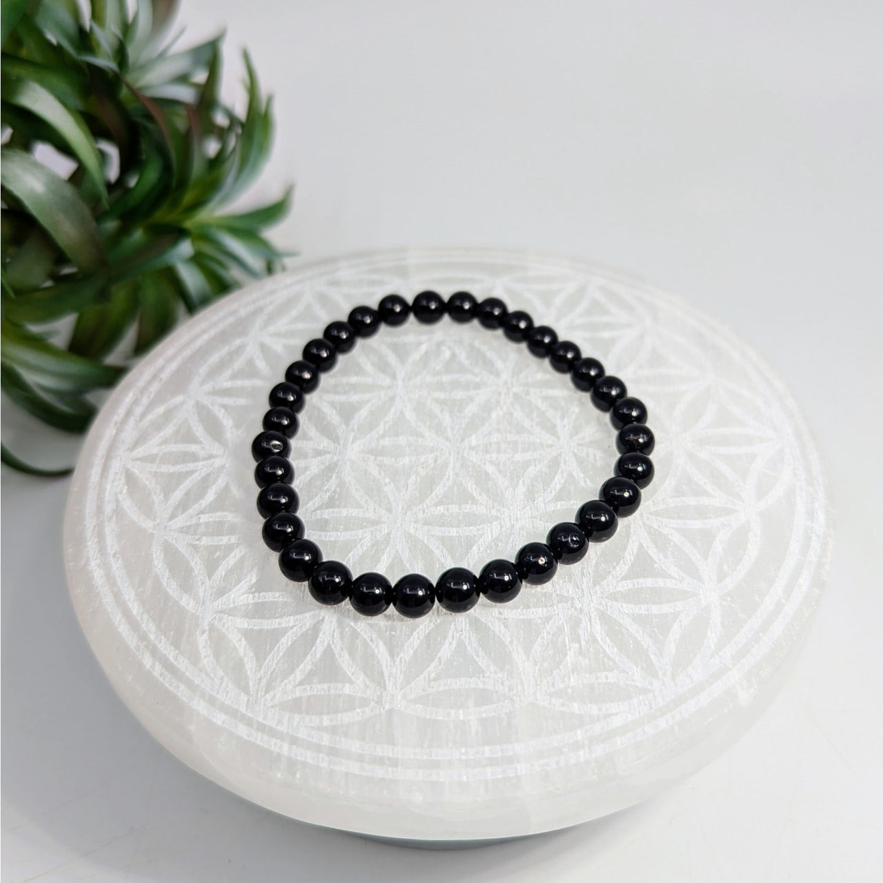 Black beaded bracelet made of Black Tourmaline 6mm beads on a 7-inch stretch design