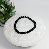 Black beaded bracelet made of Black Tourmaline 6mm beads on a 7-inch stretch design