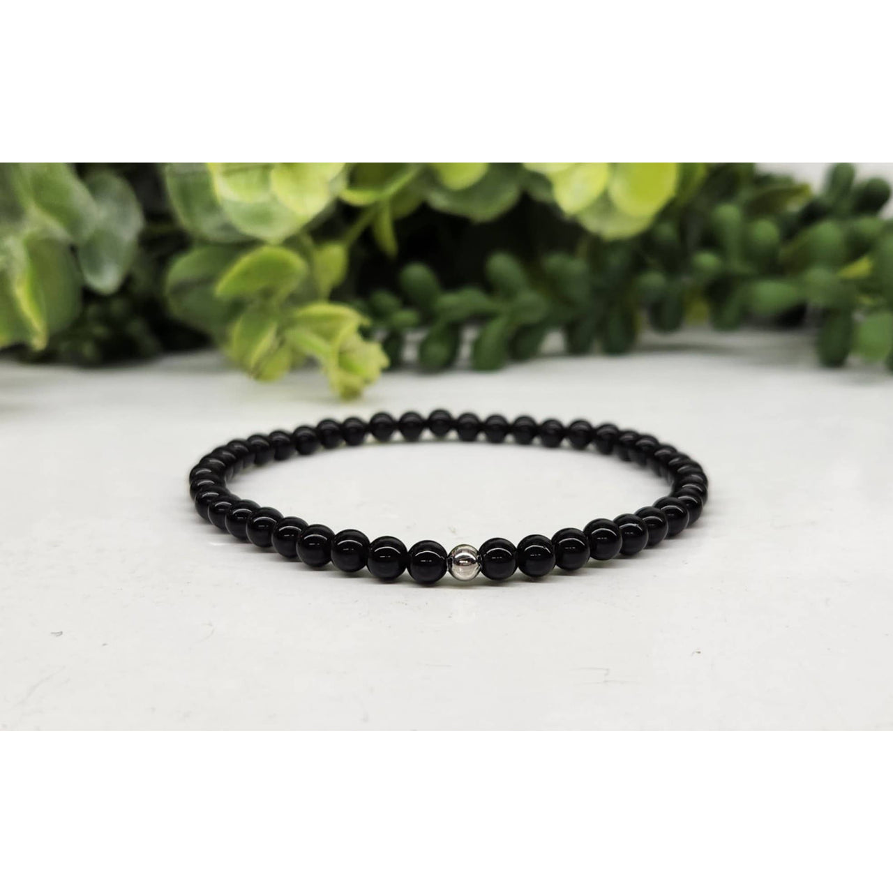 Black Tourmaline bracelet with black beads and silver accent, 7 inches long