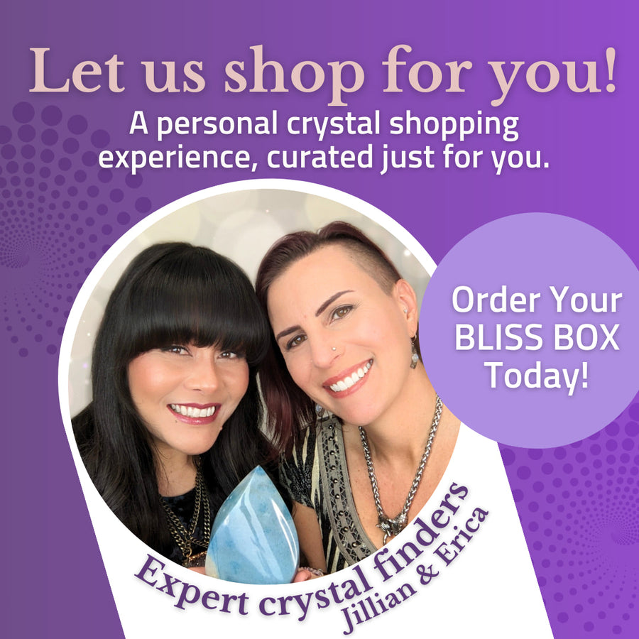 Woman holding translucent blue crystal in Bliss Box Tucson Gem Show 2026 mystery box