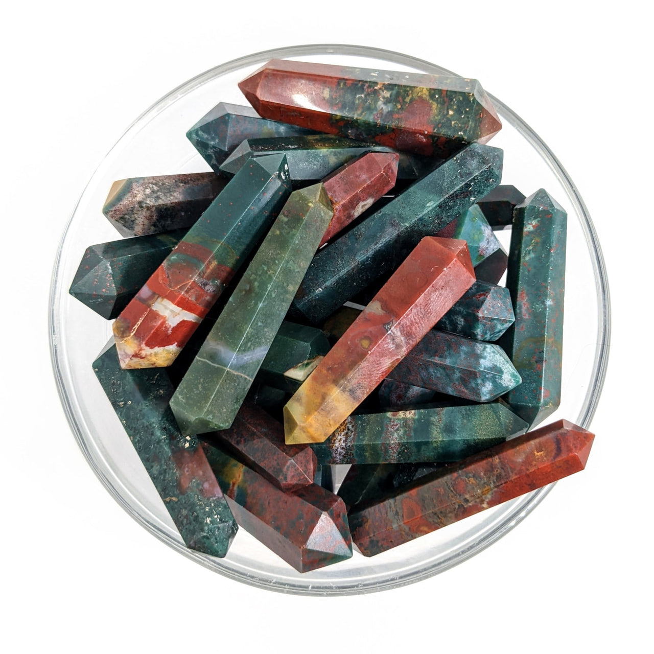 A bowl of red and green crystals from the Bloodstone 1.5’ Mini DT Point (6g) #SK9250 product