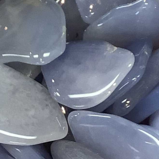 Smooth, polished gray stones of Blue Chalcedony Tumbled #T311 with a glossy finish