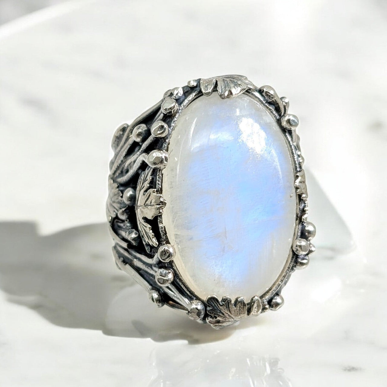 Silver ring with an oval Blue Flash Moonstone in a size 10.5 design