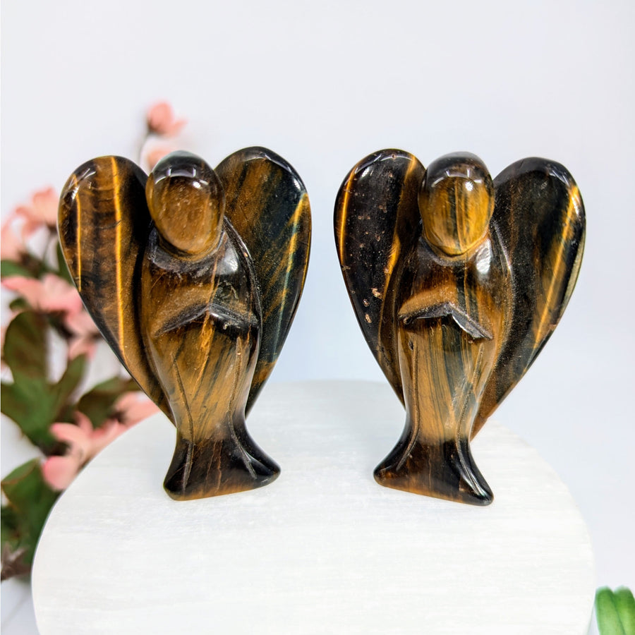 Two tiger’s eye angel figurines on the Blue Gold Tiger’s Eye 3’’ Large Angel Carving