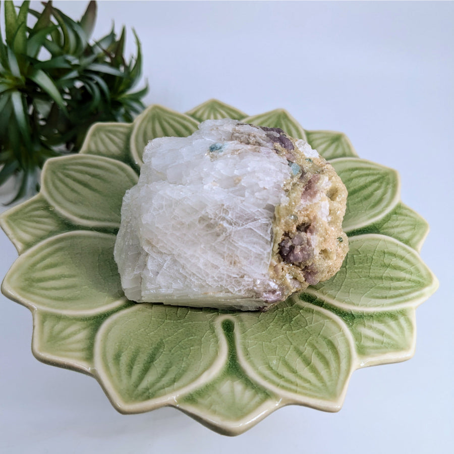 White and tan mineral specimen with blue green tourmaline, cleavelandite, and lepidolite