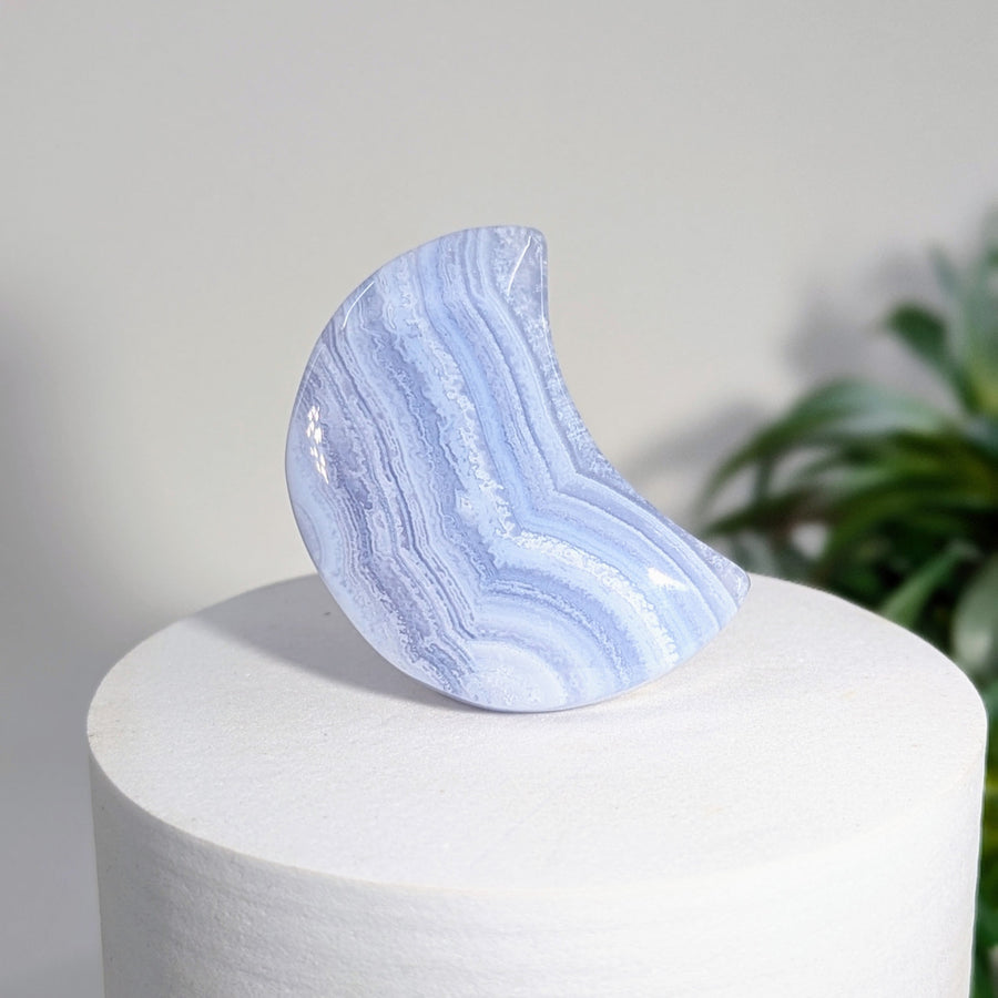 Blue lace agate 1.5 inch crescent moon carving showcasing calming blue tones