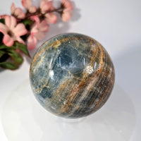 Polished 2.7-inch blue onyx aventurine sphere with golden-brown veining #BC0203
