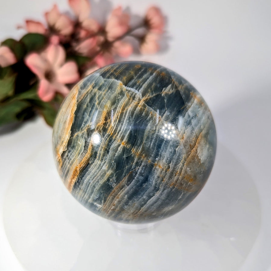 Blue Onyx 2.7’’ Sphere #BC0204 with swirling blue, gray, and golden-brown veins