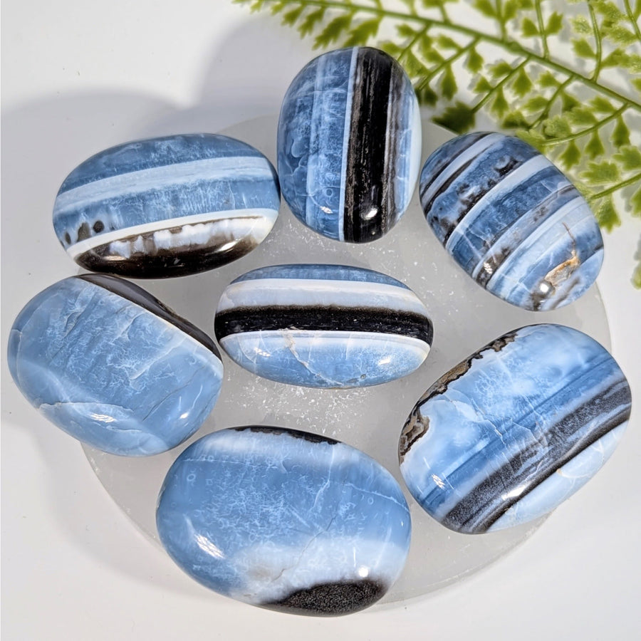Polished blue black striped agate oval palm stones Blue Opal BC0749