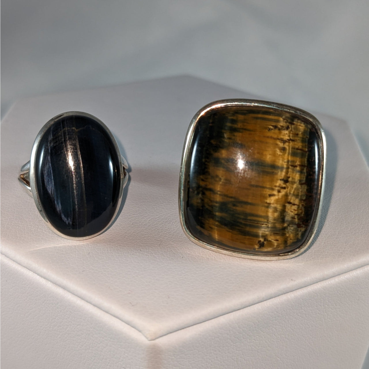 Two sterling silver rings with black onyx and amber stones in Blue Tiger’s Eye design