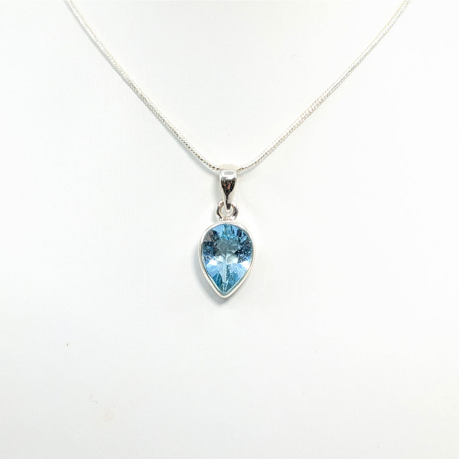 Blue Topaz teardrop pendant necklace in sterling silver jewelry display