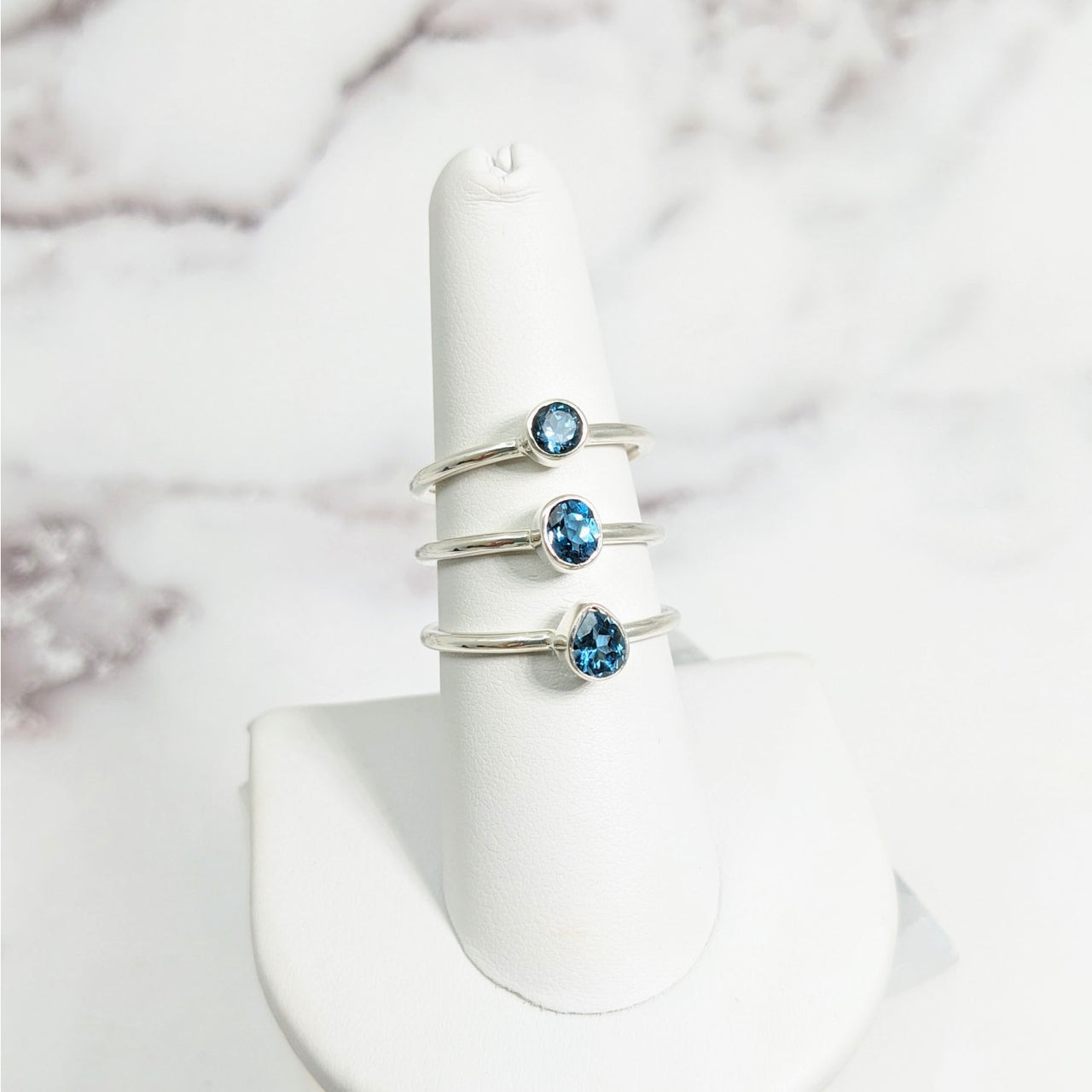 Blue Topaz S.S. Dainty Ring #LV3916 on white ring stand