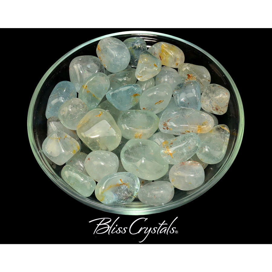 A bowl of large milky blue topaz crystals for sale