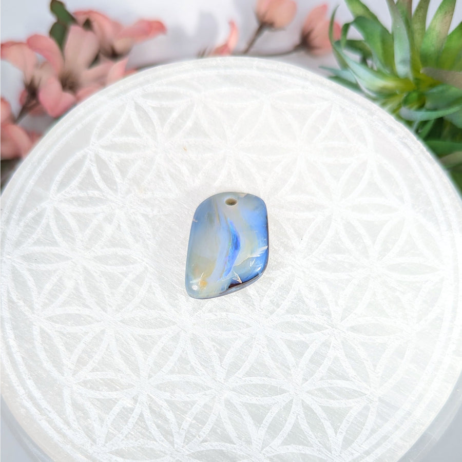 Irregularly shaped blue and yellow Boulder Opal pendant with drilled hole for jewelry