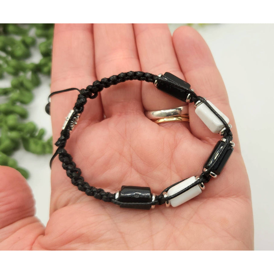 Black and white beaded bracelet featuring Black Tourmaline and White Howlite for protection