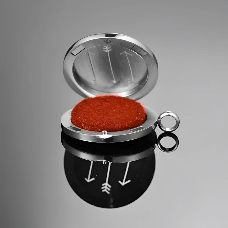 Red powder in metal container from Car Clip Diffuser: Dream Catcher Aromatherapy Essential Oil