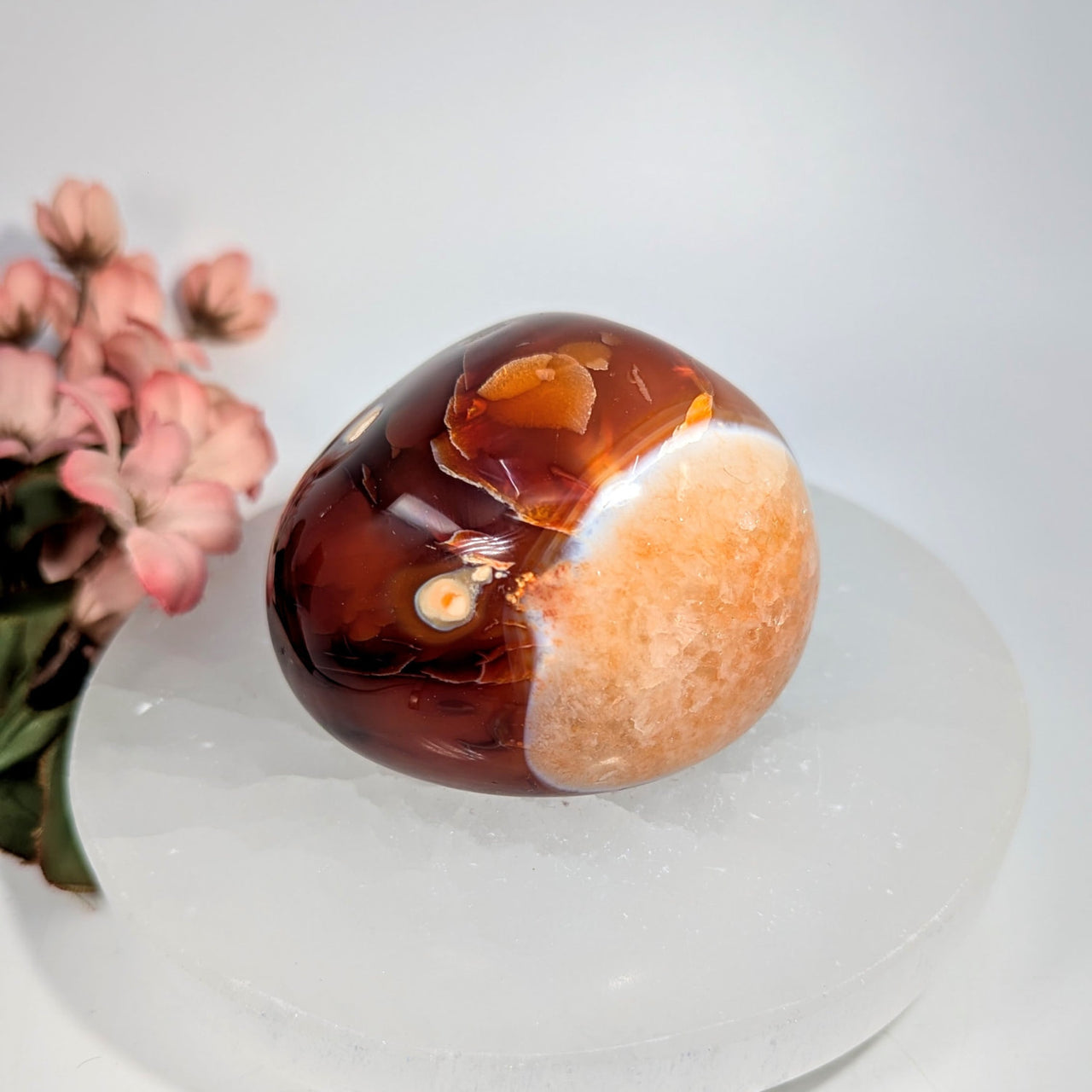 Polished 2.5-inch oval carnelian agate pebble in amber-brown with patterns #BC0652