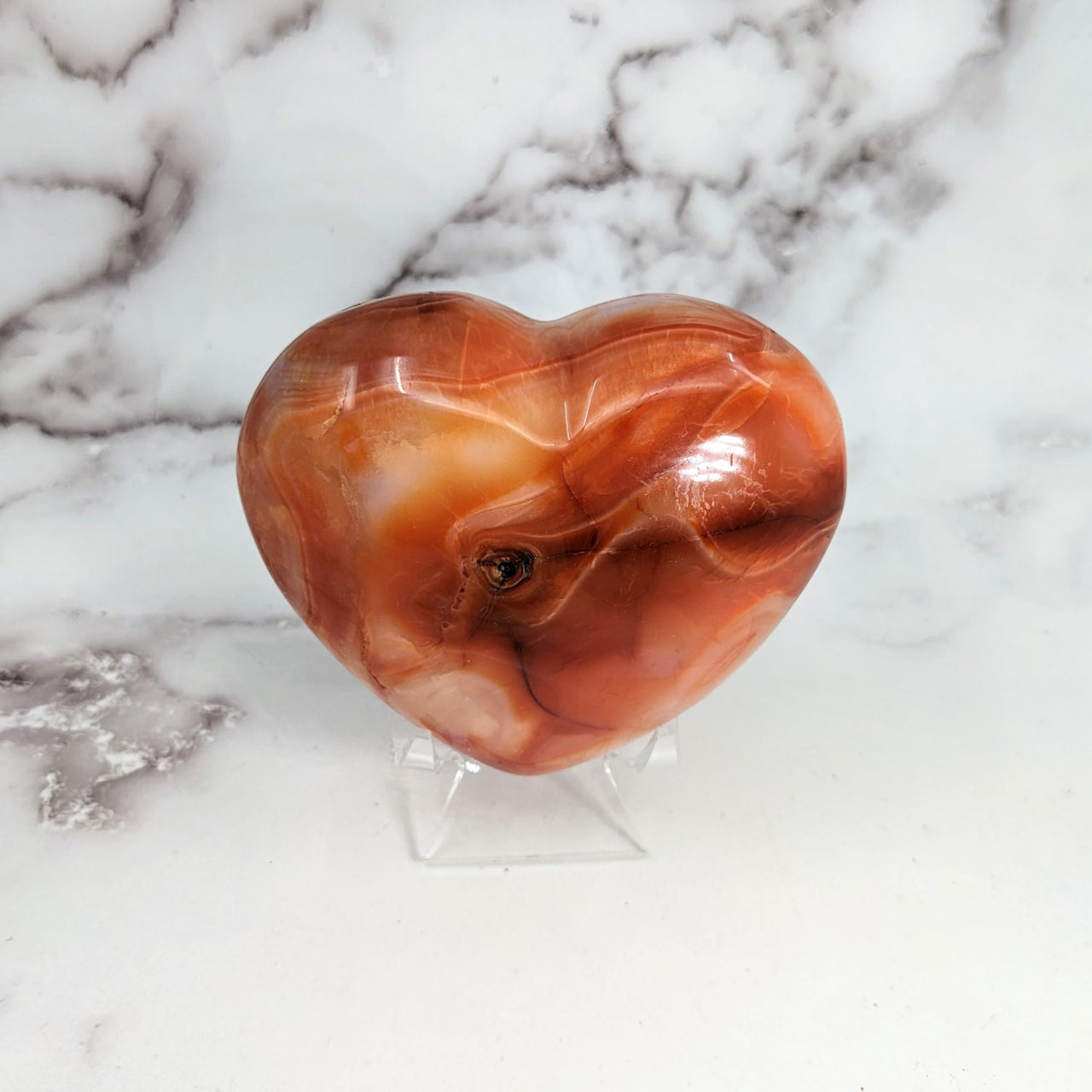 Carnelian 3.2’ Heart #LV3103: Heart-shaped glass sculpture on marble surface