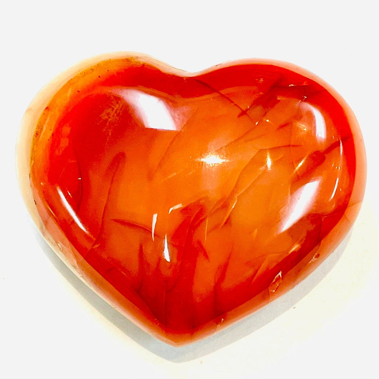 Red crystal heart with orange tones in Carnelian Heart on Stand, enhancing item tier benefits