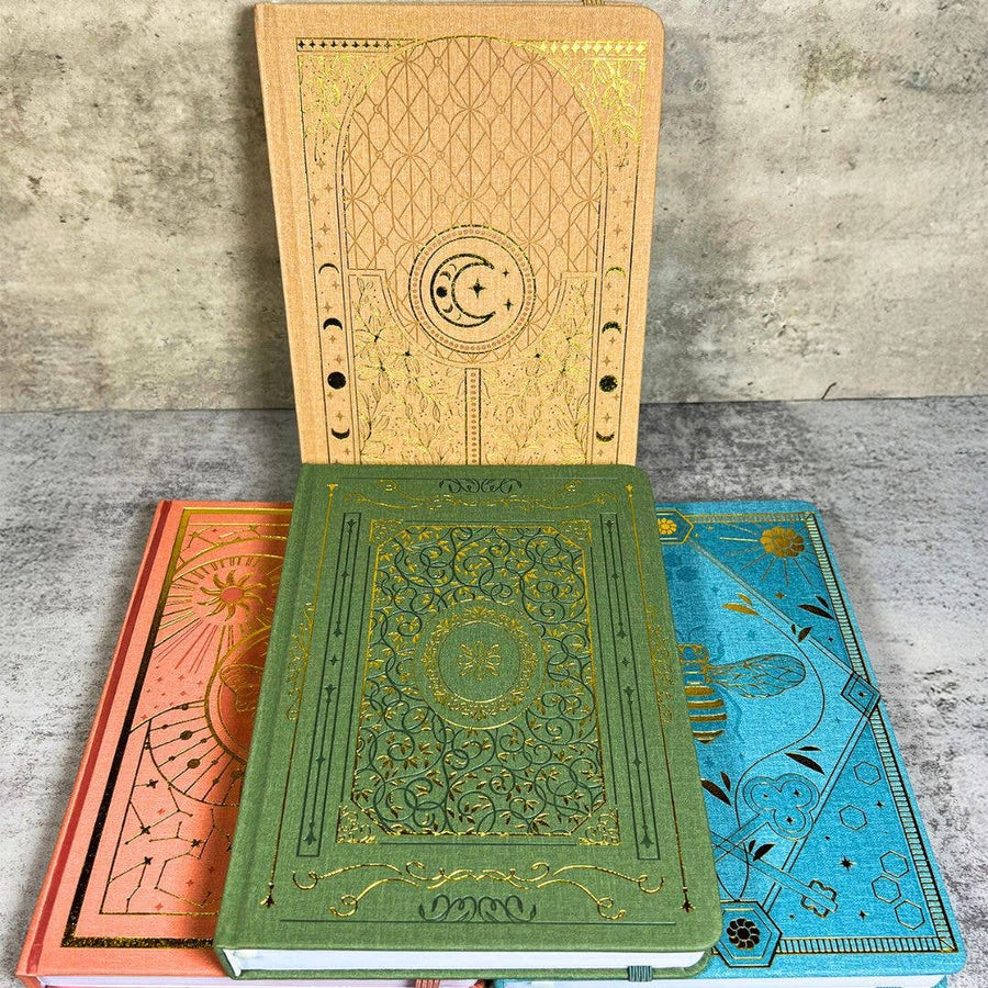 Green and gold Moleskine notebook with celestial designs LV9549