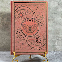 Coral pink leather Celestial Nature journal with moon phases and butterfly