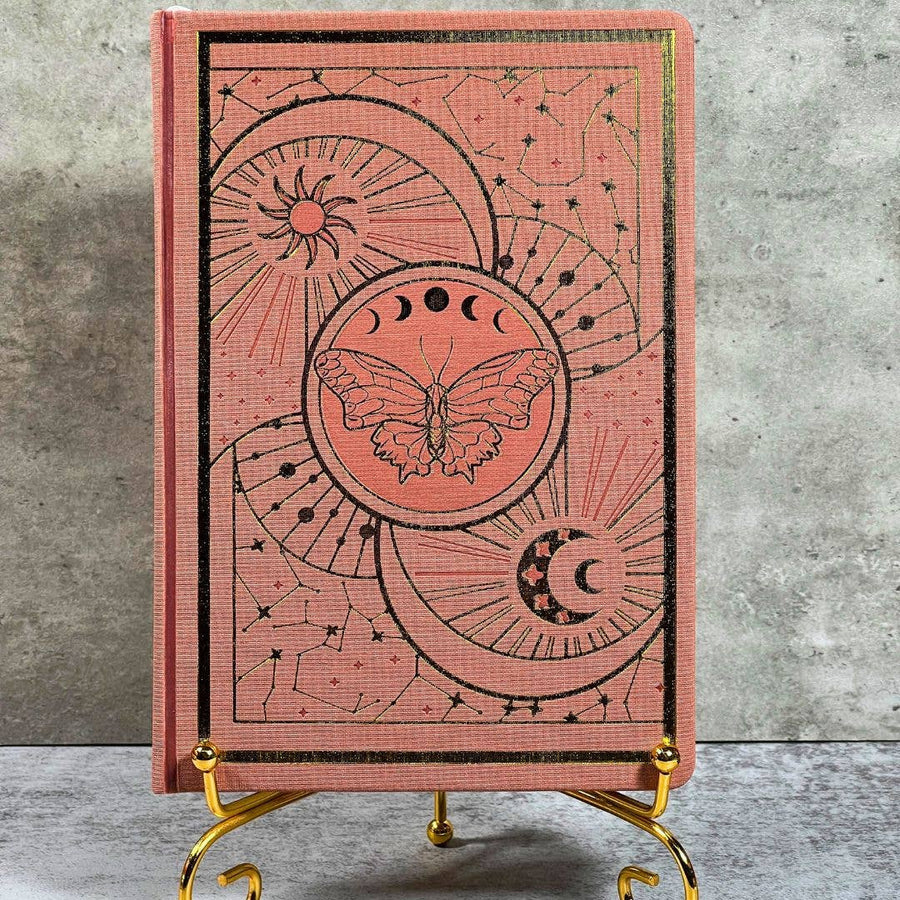 Coral pink leather Celestial Nature journal with moon phases and butterfly