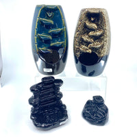 Blue green ceramic boat dish with fish design on black base, Q335 burner