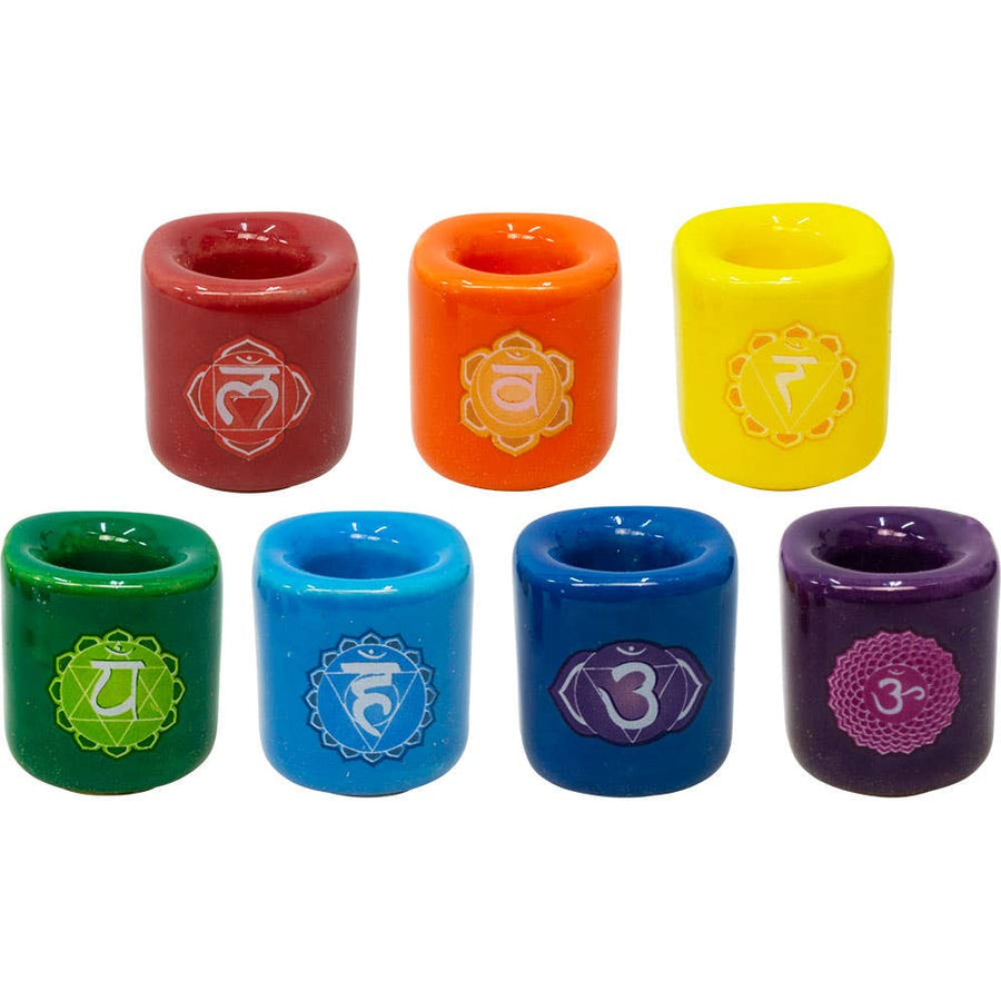 Seven chakra-themed ceramic candle holders from the Ceramics Chime Chakra Candle Holder collection