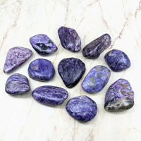 Thumbnail for Close up of Charoite Tumbled Stones #SK2183 on marble surface