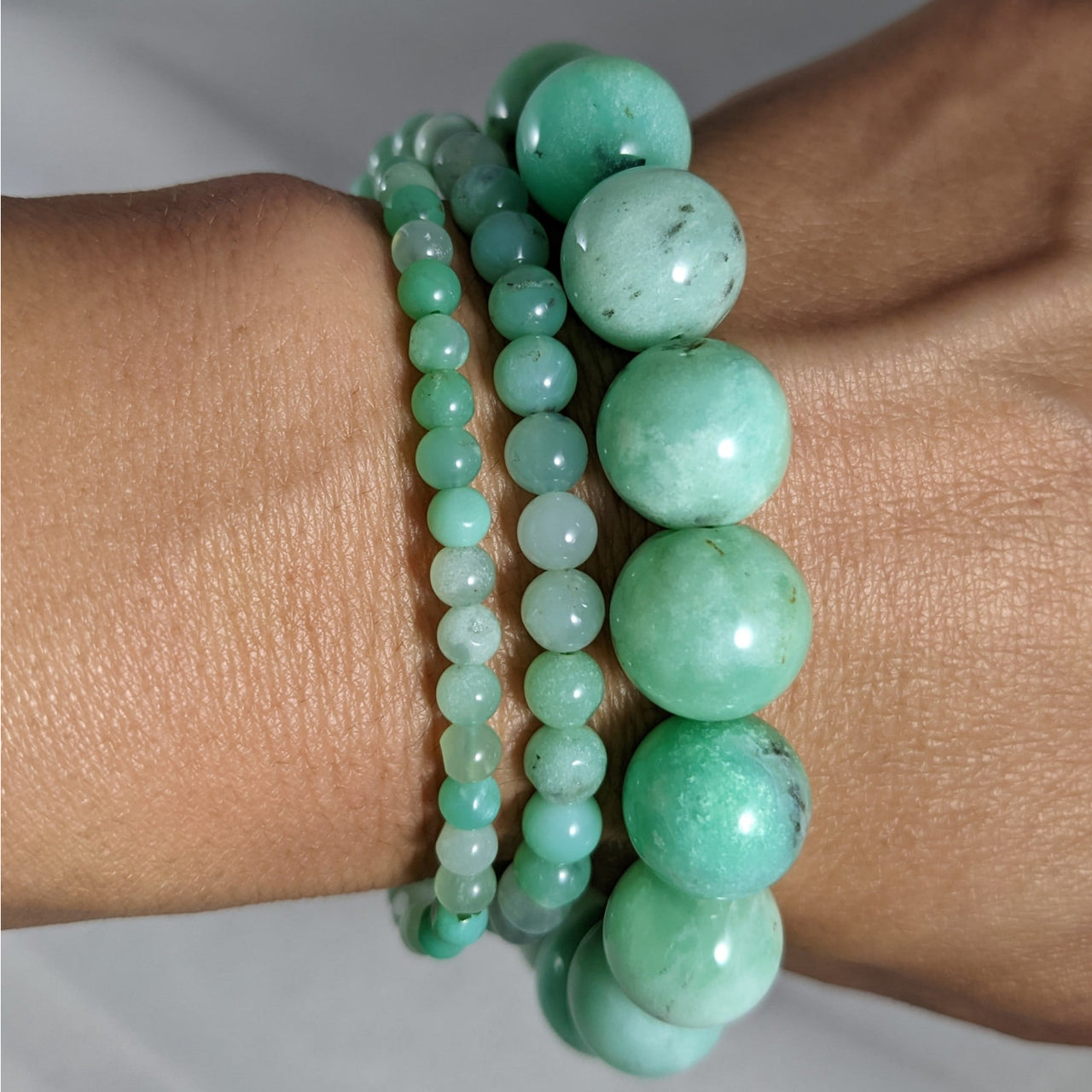 Three mint green jade beaded bracelets stacked on wrist, perfect for Chrysoprase Bracelet