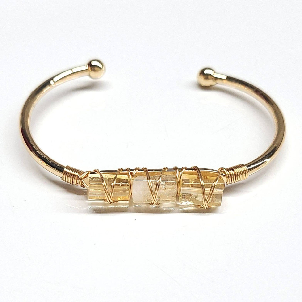 Gold-toned cuff bangle bracelet with three wrapped citrine stones for stylish 5-inch wristwear model BC0491