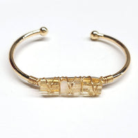 Gold-toned cuff bangle bracelet with three wrapped citrine stones for stylish 5-inch wristwear model BC0491