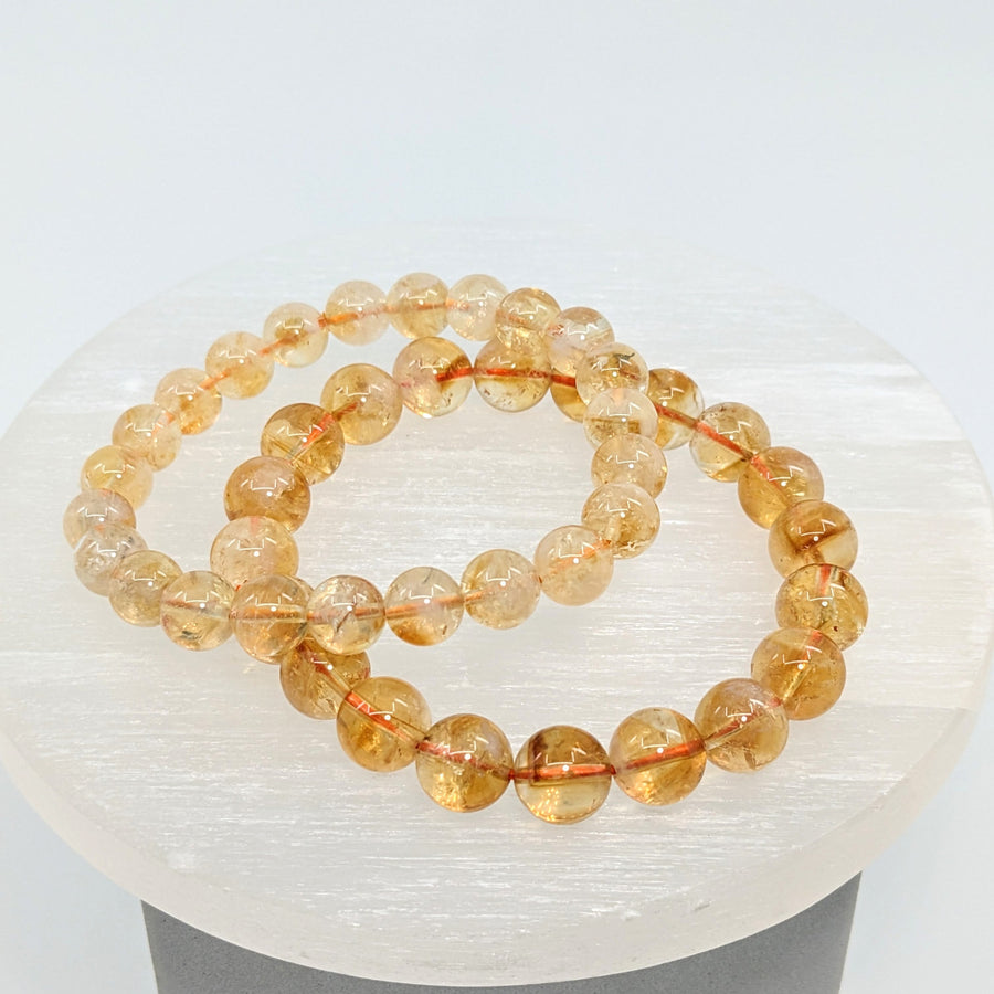Pair of golden-orange citrine 8-9mm round beaded bracelets LV1880