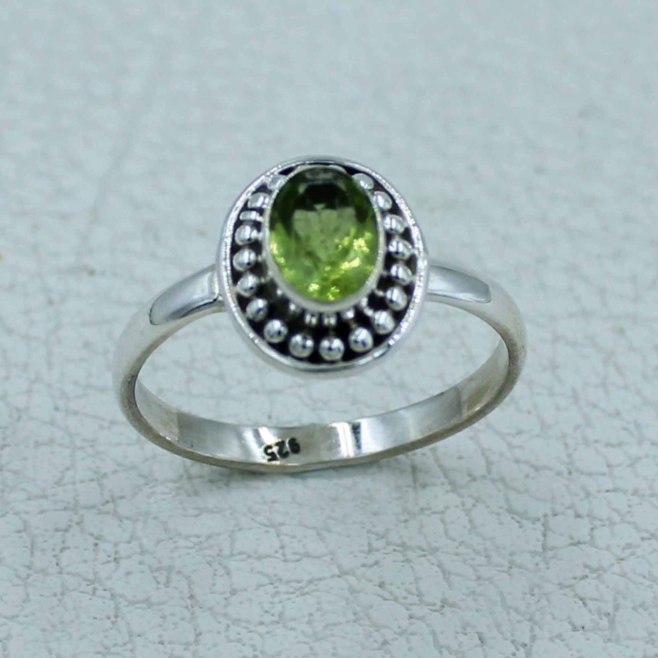 Oval peridot sterling silver ring with beaded bezel, BC0407