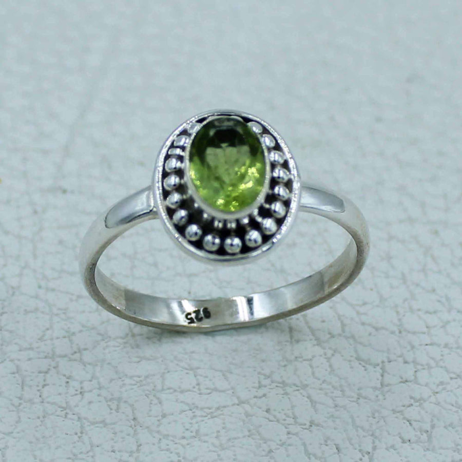 Oval peridot sterling silver ring with beaded bezel, BC0407