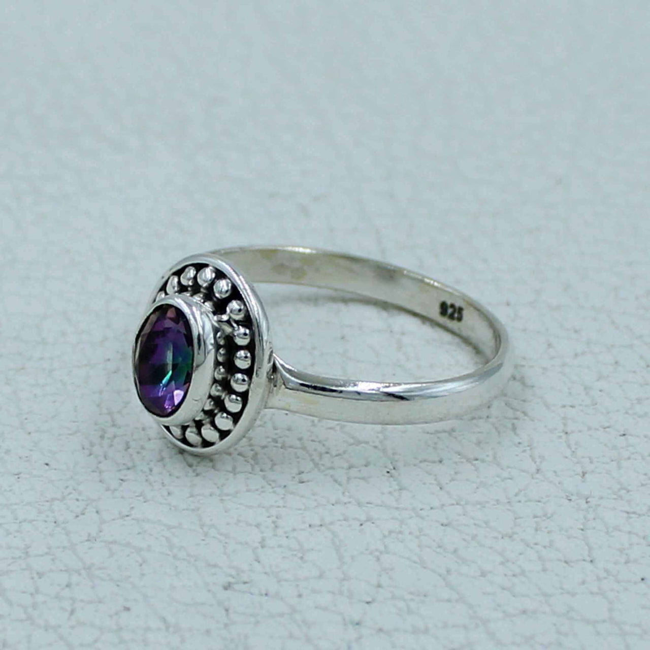 Oval faceted citrine or peridot sterling silver ring with iridescent purple gemstone and beaded bezel