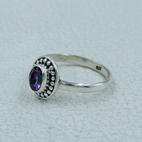 Oval faceted citrine or peridot sterling silver ring with iridescent purple gemstone and beaded bezel